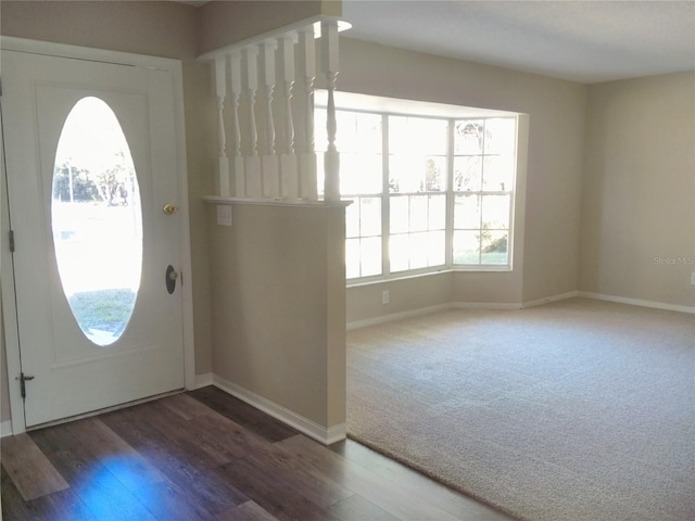 foyer featuring dark hardwood / wood-style flooring and plenty of natural light