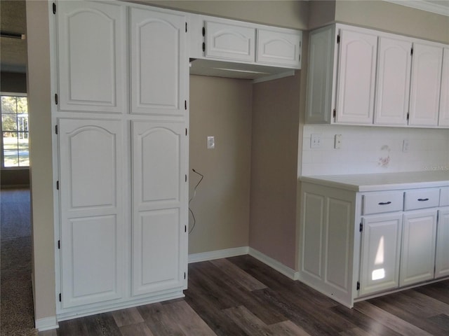 kitchen featuring white cabinets and dark hardwood / wood-style floors