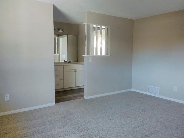 unfurnished bedroom featuring light carpet