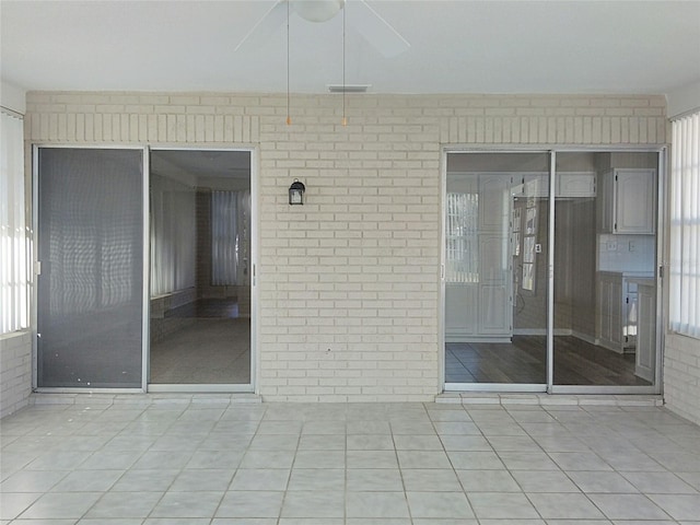 interior space with ceiling fan and a healthy amount of sunlight