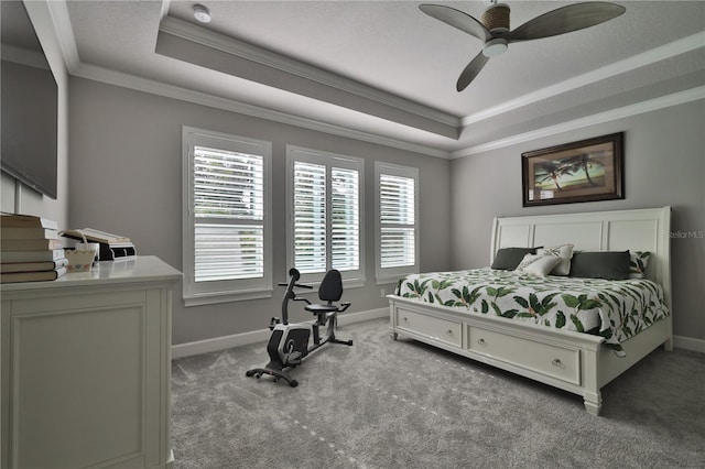 bedroom with a raised ceiling, ceiling fan, crown molding, and light carpet