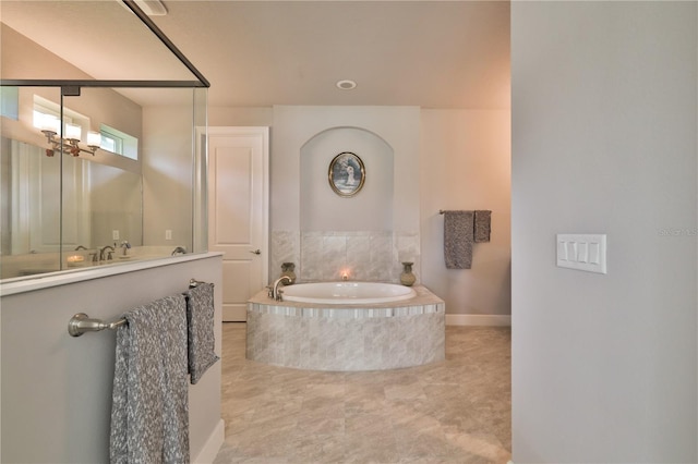 bathroom with tiled bath