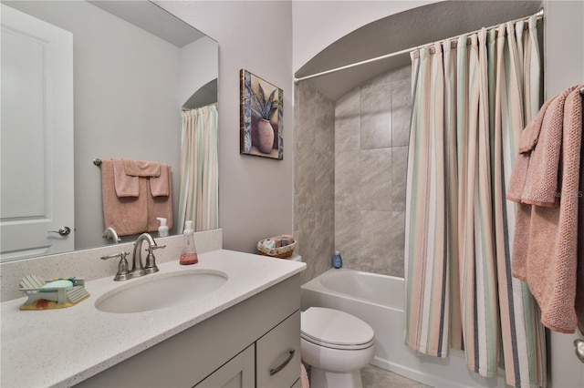 full bathroom featuring vanity, toilet, and shower / bathtub combination with curtain