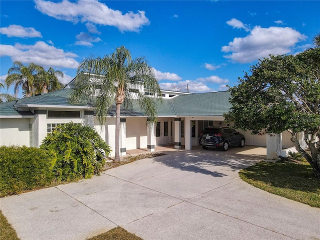 view of front of home with a carport