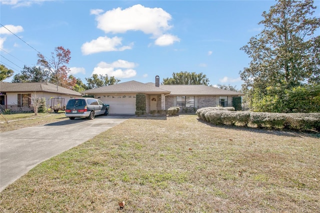 single story home with a garage and a front lawn