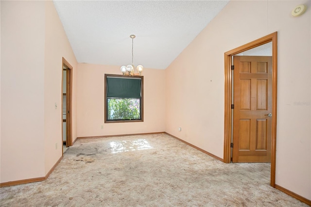 unfurnished room with a notable chandelier, light colored carpet, and lofted ceiling