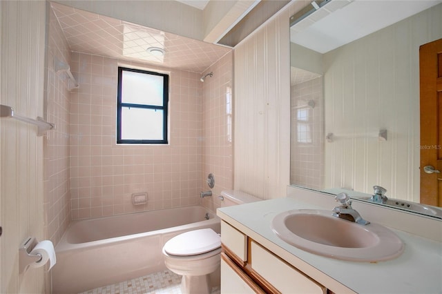 full bathroom featuring tile patterned flooring, vanity, toilet, and tiled shower / bath