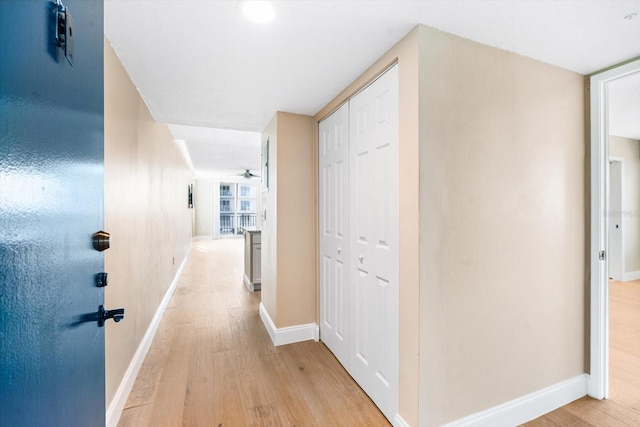 hall with light hardwood / wood-style flooring