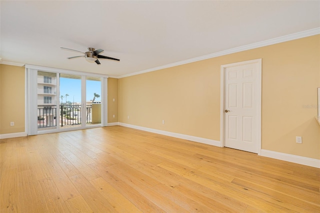 unfurnished room featuring floor to ceiling windows, crown molding, light hardwood / wood-style floors, and ceiling fan