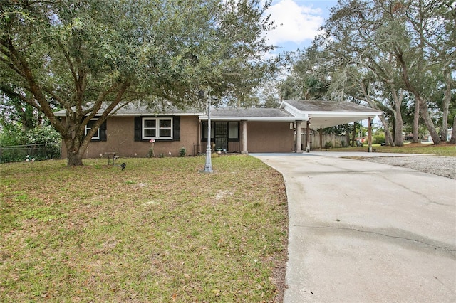 ranch-style house with a carport and a front lawn