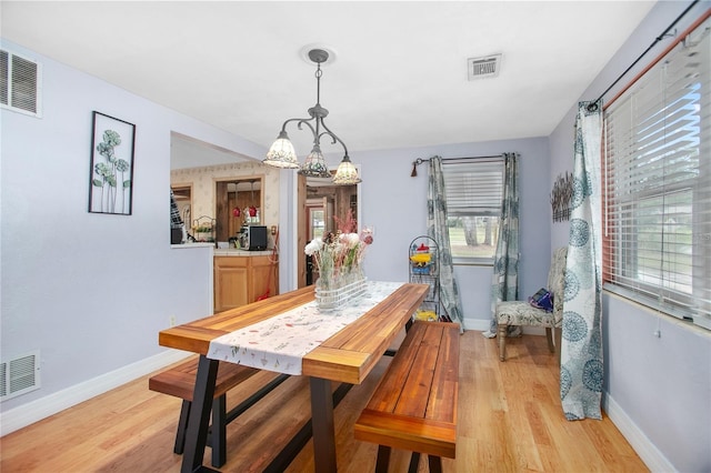 dining area with light wood-type flooring