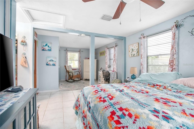 tiled bedroom with ceiling fan