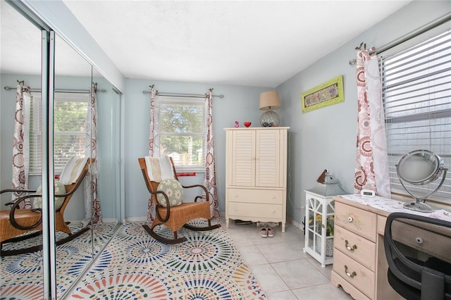 sitting room featuring light tile patterned floors