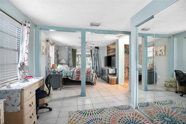 bedroom with light tile patterned floors