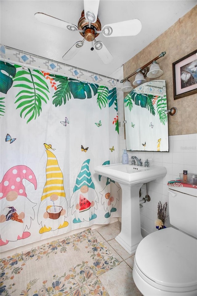 bathroom with toilet, tile patterned flooring, and ceiling fan