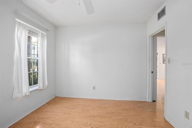 unfurnished room featuring ceiling fan and light hardwood / wood-style flooring