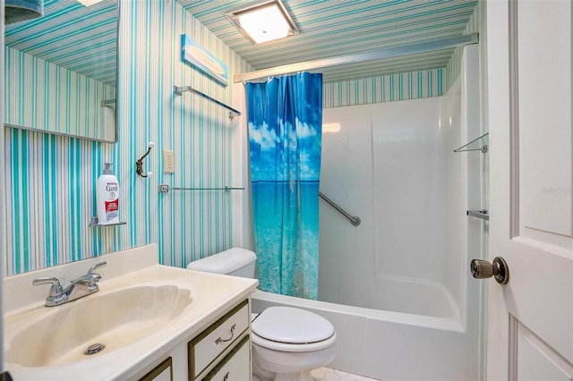 full bathroom featuring shower / tub combo with curtain, vanity, and toilet