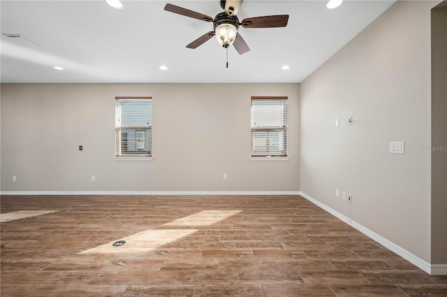 empty room featuring ceiling fan and a healthy amount of sunlight