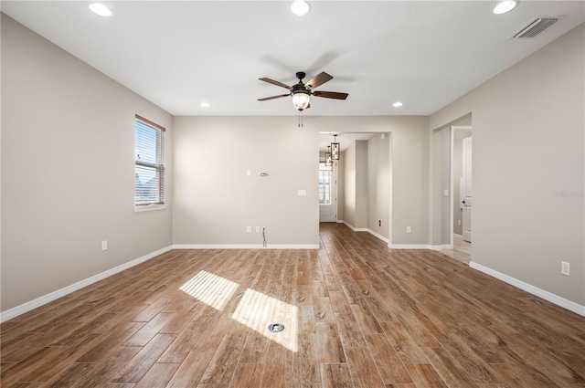 unfurnished room with ceiling fan and plenty of natural light