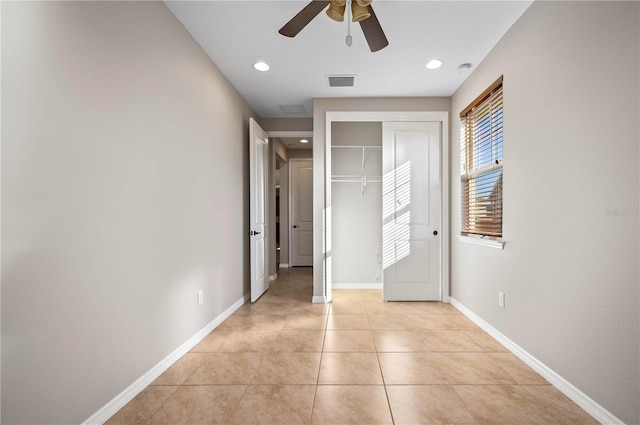 interior space featuring ceiling fan and light tile patterned floors