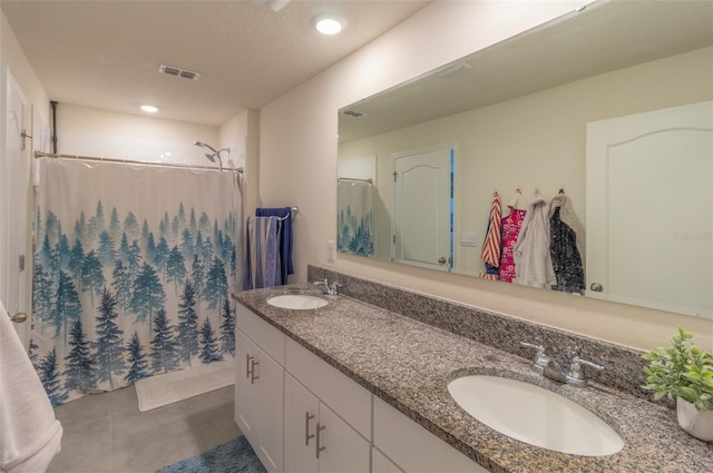 bathroom featuring tile patterned floors, a shower with curtain, and vanity