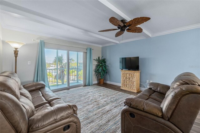 living room with ceiling fan, ornamental molding, beam ceiling, and hardwood / wood-style floors