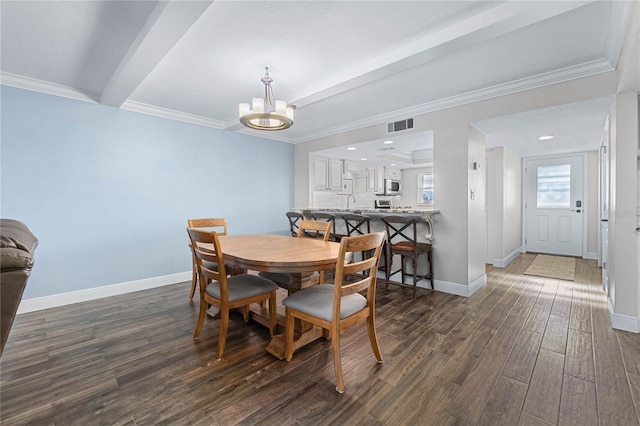 dining area featuring beam ceiling, dark hardwood / wood-style floors, crown molding, and a chandelier