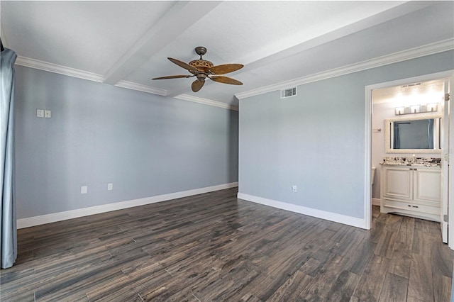 empty room featuring ceiling fan, dark hardwood / wood-style floors, sink, beamed ceiling, and crown molding