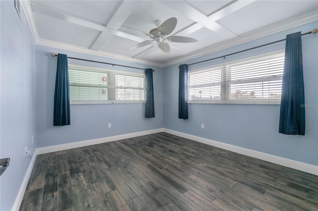 empty room with dark wood-type flooring, a wealth of natural light, and coffered ceiling