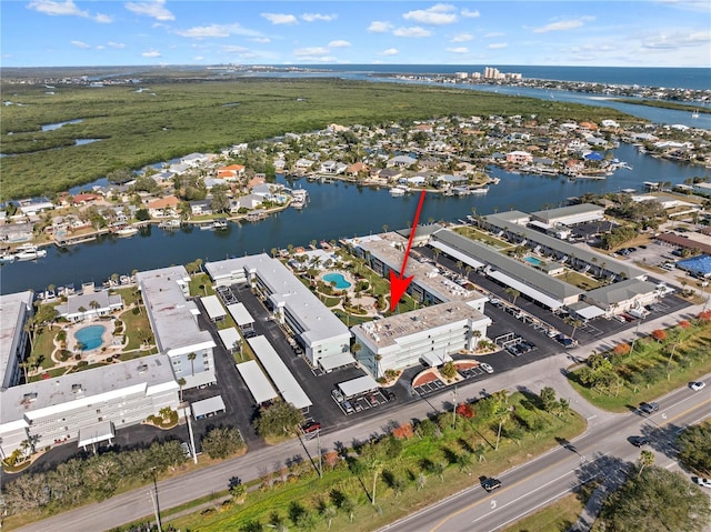 birds eye view of property featuring a water view