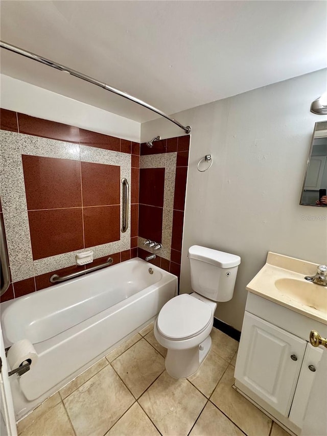 full bathroom with tile patterned flooring, vanity, toilet, and tiled shower / bath