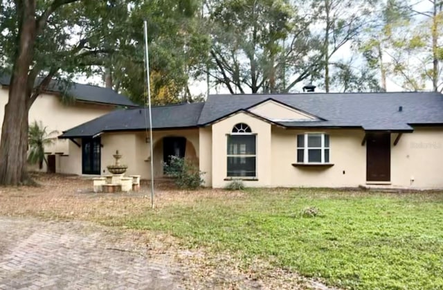 back of house featuring a yard