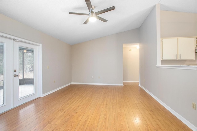 unfurnished room featuring lofted ceiling, french doors, ceiling fan, and light hardwood / wood-style floors