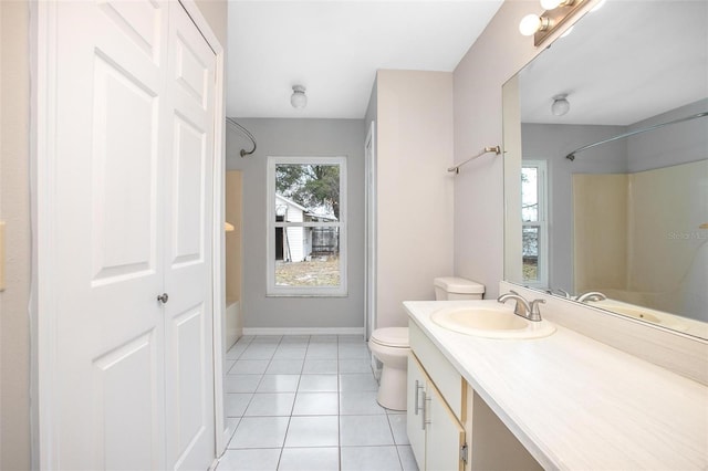 bathroom featuring toilet, tile patterned floors, and vanity