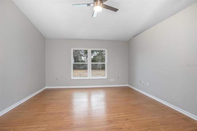 spare room with ceiling fan and light hardwood / wood-style floors