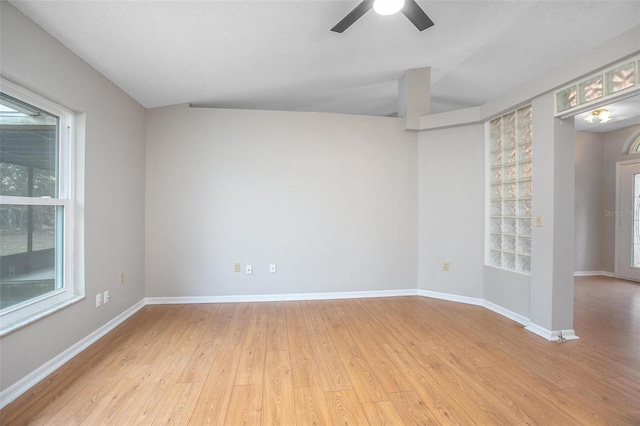 spare room featuring ceiling fan and light hardwood / wood-style flooring