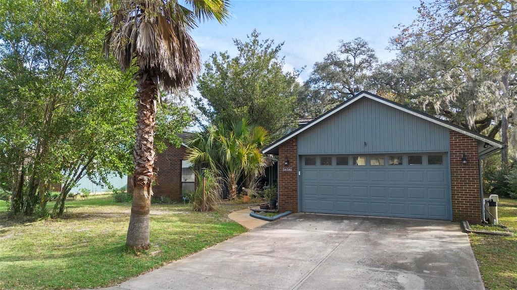 ranch-style house with a front lawn and a garage