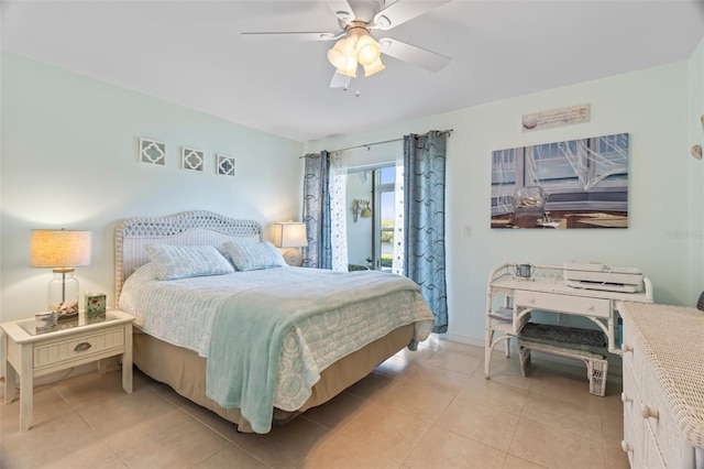 bedroom with ceiling fan and light tile patterned floors