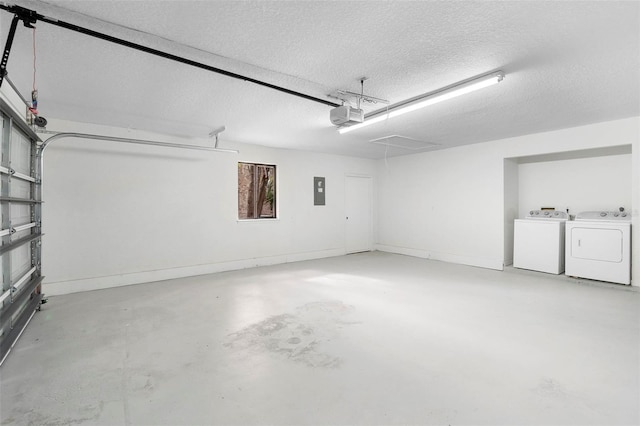 garage featuring a garage door opener and washing machine and dryer