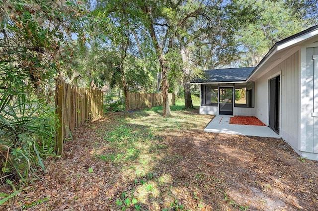 view of yard with a sunroom