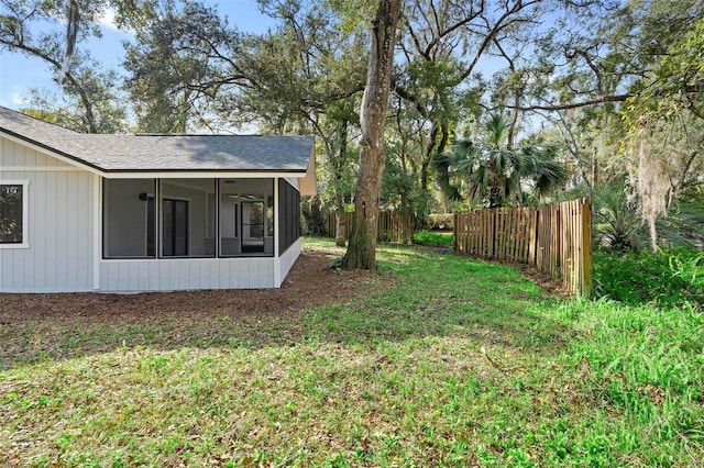 view of yard with a sunroom