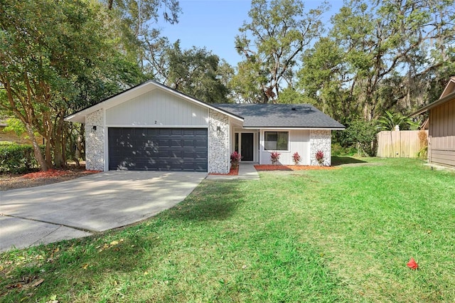 ranch-style home with a front yard and a garage