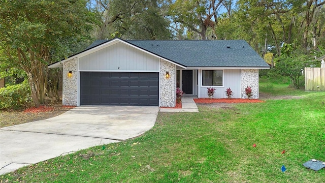 single story home featuring a front yard and a garage