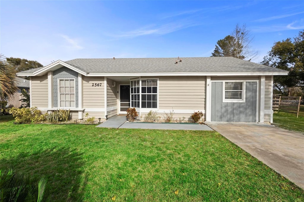 rear view of house with a yard