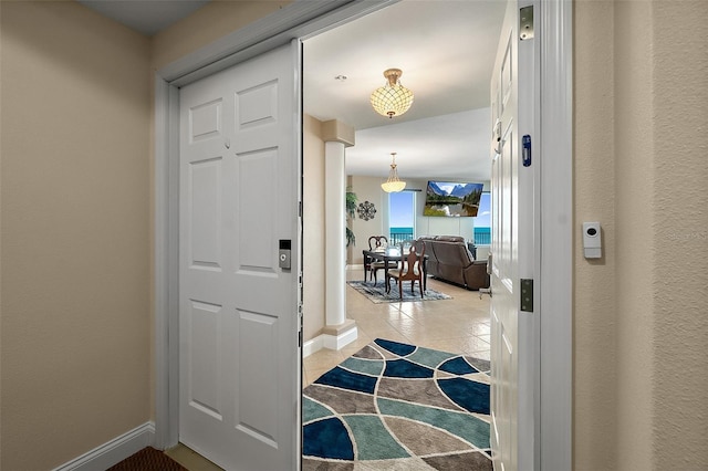 foyer entrance with light tile patterned floors