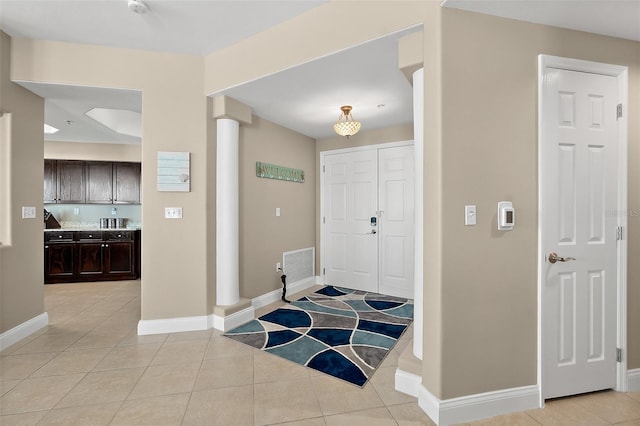 foyer with light tile patterned floors