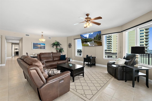 tiled living room featuring ceiling fan