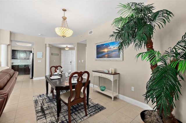 dining area featuring light tile patterned floors