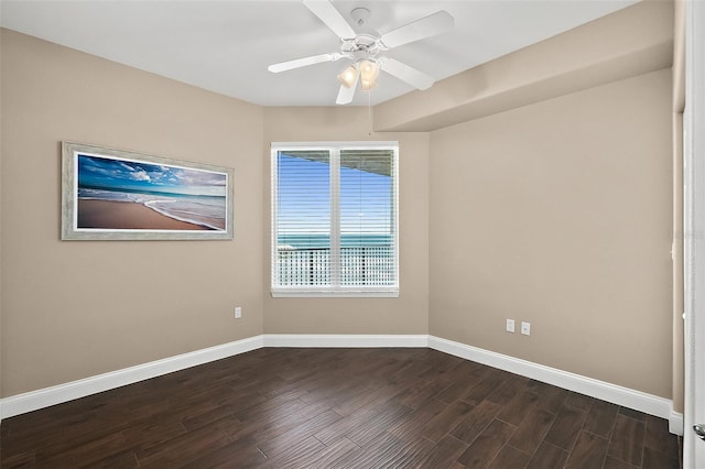 unfurnished room with ceiling fan and dark wood-type flooring