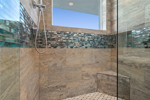 bathroom featuring a tile shower